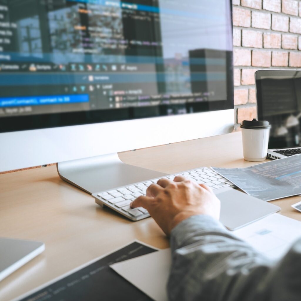 Photo of hand navigating desktop computer