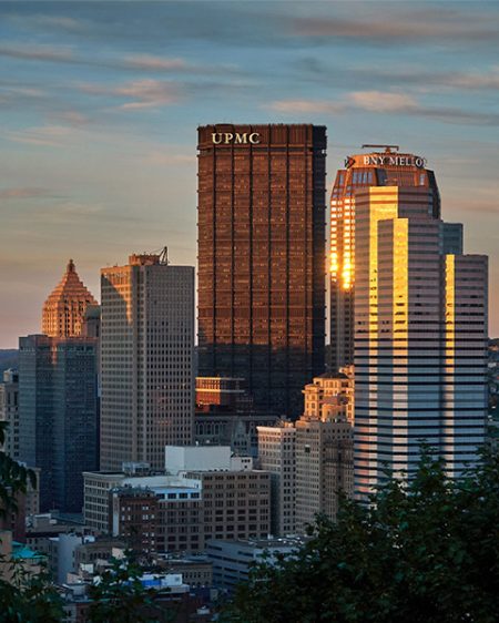 Tall buildings in the Pittsburgh skyline at sunset..